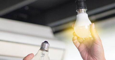 Consumer changing incandescent lamp with a new LED light bulb
